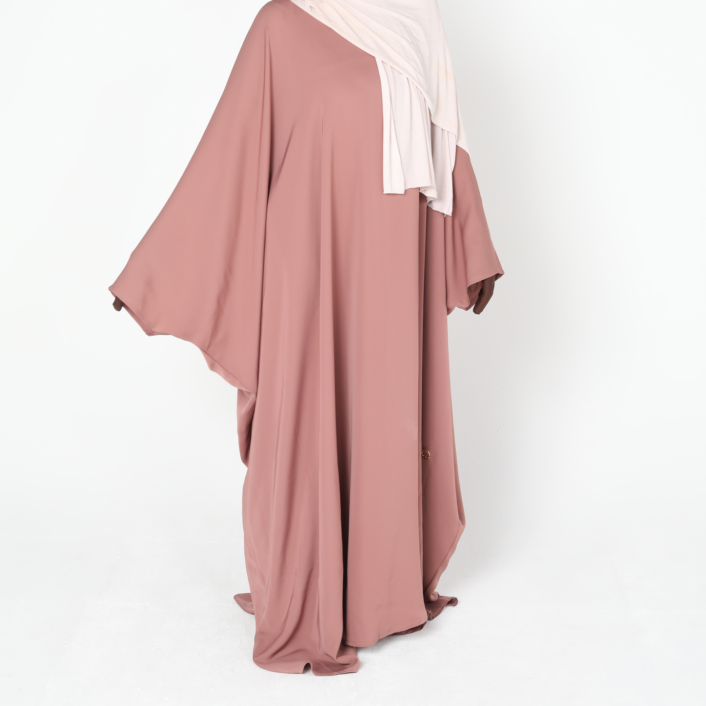 Mauve abaya with a white hijab on a white background